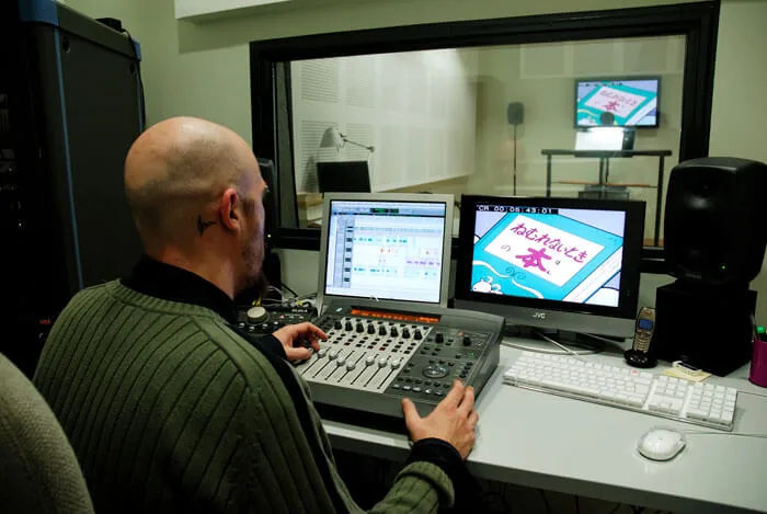 A man working in a dubbing studio